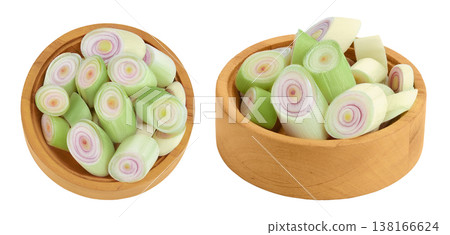 Fresh Lemongrass in wooden bowl isolated on white background . Top view. Flat lay Fresh Lemongrass in wooden bowl isolated on white background . Top view. Flat lay 138166624