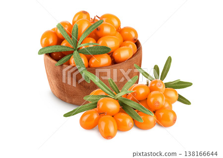 Sea buckthorn in wooden bowl. Fresh ripe berry with leaves isolated on white background macro 138166644