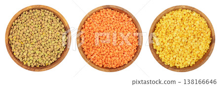 green red end yellow lentil in wooden bowl isolated on white background. Top view green red end yellow lentil in wooden bowl isolated on white background. Top view 138166646
