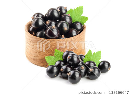 black currant with leaf in wooden bowl isolated on white background 138166647