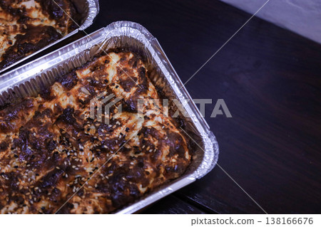 Close up shot of a golden brown crusty pie sprinkled with white sesame seeds. Close up shot of a golden brown crusty pie sprinkled with white sesame seeds. 138166676