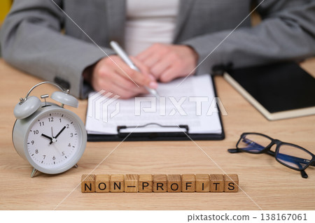 Writing important documents for non-profit organizations while managing time efficiently in a modern office setting Writing important documents for non-profit organizations while managing time efficiently in a modern office setting 138167061