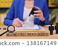 Engagement in municipal paperwork with attention to detail in a bright office setting 138167149