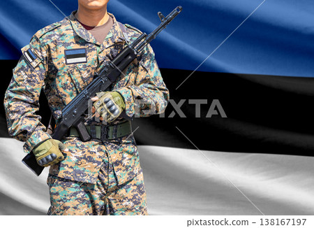 Estonia flag with soldier holding assault rifle 138167197