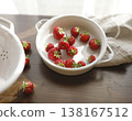 Fresh red strawberries in white ceramic vintage bowl on dark wooden table. Aesthetic food photography showcases organic summer berries for slow living breakfast and cottagecore kitchen vibes. 138167512