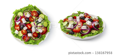 Greek salad in a flat plate close-up view from above and from the side isolated on a white background. Greek salad in a flat plate close-up view from above and from the side isolated on a white background. 138167958