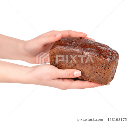 Loaf cake in female hands isolated on white background Loaf cake in female hands isolated on white background 138168175