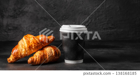 Croissants and takeaway coffee cup on dark background, breakfast bakery composition 138168185