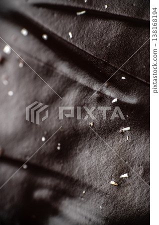 Chocolate glaze texture macro background with glossy dark surface 138168194