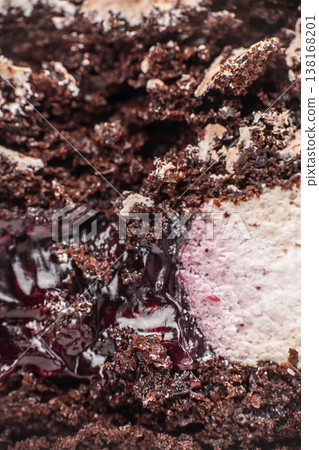 Chocolate cake filling macro with berry jam and cream texture Chocolate cake filling macro with berry jam and cream texture 138168201