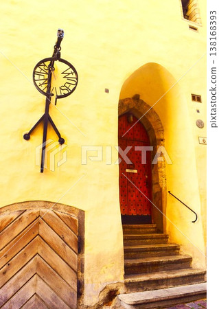 Houses with yellow exteriors and wooden doors in Tallinn's Old Town Houses with yellow exteriors and wooden doors in Tallinn's Old Town 138168393
