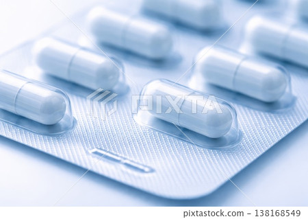 Blister pack with white capsules close up pharmaceutical medicine concept Blister pack with white capsules close up pharmaceutical medicine concept 138168549