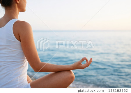 Woman Practicing Yoga Meditation Pose by Sea Relaxation and Mindfulness Concept Woman Practicing Yoga Meditation Pose by Sea Relaxation and Mindfulness Concept 138168562