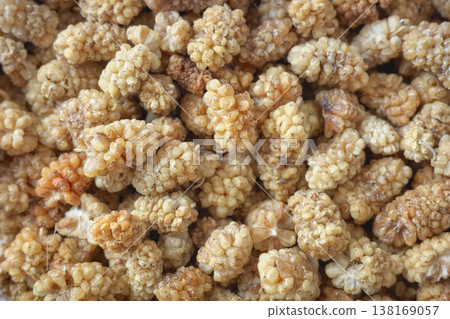 Close up photo of dried white mulberry, selective focus. Close up photo of dried white mulberry, selective focus. 138169057