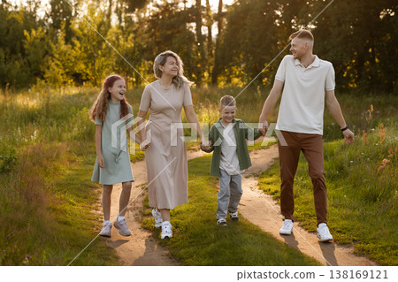 Excited Family Members Engage In Spontaneous Walk Amidst Vibrant And Cheerful Environment With Kids 138169121