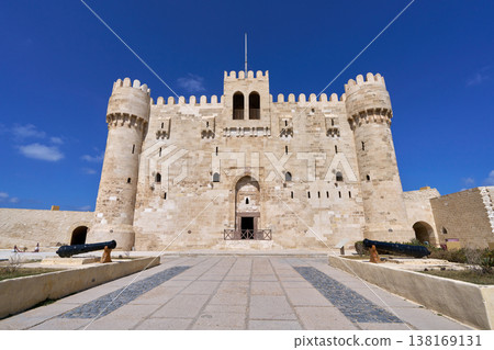 The Qaitbey Fortress of Alexandria stands under a blue sky. The Qaitbey Fortress of Alexandria stands under a blue sky. 138169131
