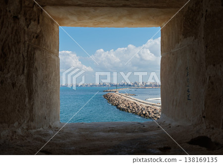 A view of the Alexandria coastline from the window of Qaitbay Fortress. A view of the Alexandria coastline from the window of Qaitbay Fortress. 138169135