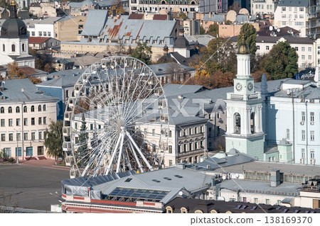 Kontraktova Square in Kyiv with Ferris wheel and historic clock tower. Kyiv, Ukraine Kontraktova Square in Kyiv with Ferris wheel and historic clock tower. Kyiv, Ukraine 138169370
