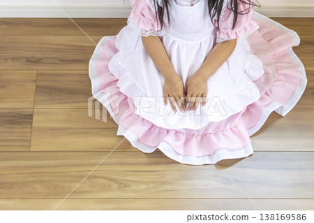 A girl (faceless, 5 years old, Japanese) sitting on the floor in a maid outfit. A girl (faceless, 5 years old, Japanese) sitting on the floor in a maid outfit. 138169586
