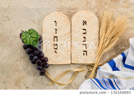 Shavuot concept with tablets, wheat, grapes, and tallit 138169893