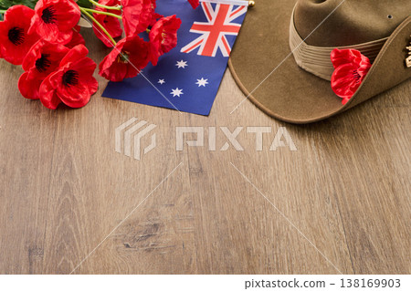 Anzac day commemorating australian soldiers with poppies and hat Anzac day commemorating australian soldiers with poppies and hat 138169903