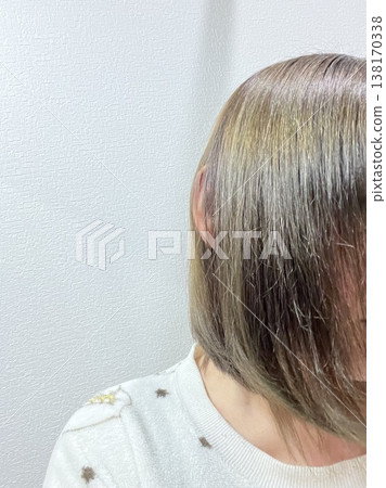 A woman with ash-blonde bob hair, profile view. 138170338