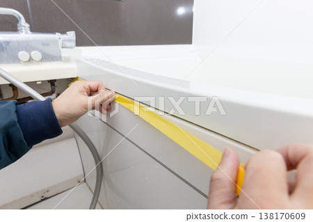 Masking when replacing caulking in the bathroom Masking when replacing caulking in the bathroom 138170609