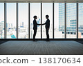 Silhouette of a businessman shaking hands 138170634