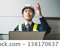 Image of a male construction manager checking something. 138170637