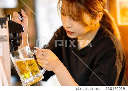 A woman poured beer A woman poured beer 138170939