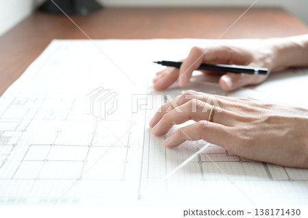 A Japanese architect drawing architectural plans A Japanese architect drawing architectural plans 138171430