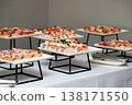 Assorted catering dessert with fruit tart and honey cake slices on buffet table for event or party decoration with no people and serving tongs 138171550