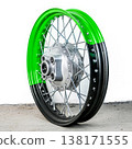 Bicolor green and black motorcycle wheel rim in perspective view with silver spoke and hub isolated on white background for motorbike custom repair 138171555