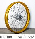 Gold motorcycle wheel rim in perspective view with silver spoke and hub isolated on white background for motorbike custom tuning and spare part repair 138171558