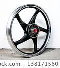 Black and silver motorcycle wheel rim cast alloy five spoke design in perspective view isolated on white background for motorbike custom and repair 138171560