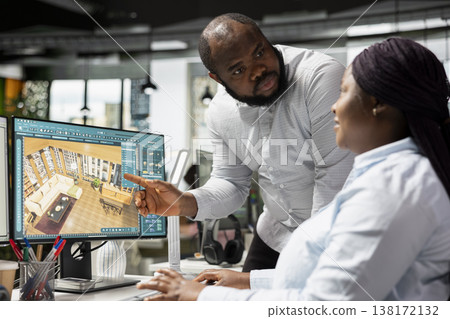 Black employees team using architectural CAD software for modern layout design, 3D rendering program on dual monitors. Architectural floor plan with tools and assets used for remodeling. Black employees team using architectural CAD software for modern layout design, 3D rendering program on dual monitors. Architectural floor plan with tools and assets used for remodeling. 138172132