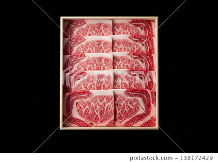 Premium marbled Wagyu beef in a paulownia wood box (for sukiyaki, foldable serving dish, black background) 138172429
