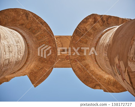 A view looking up at the capitals of the Karnak Temple columns, which still bear painted hieroglyphs (Luxor, Egypt). 138172727