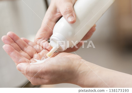 A woman's hands applying makeup. 138173193