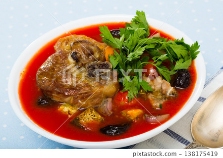 Spicy tomato soup with lamb, prunes and dried apricots 138175419