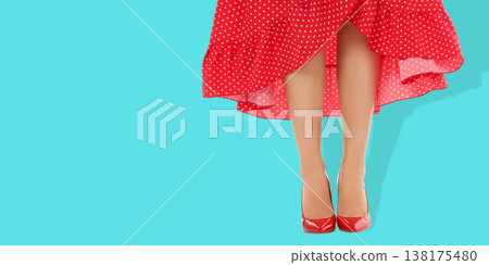 Woman in bright space wears red shoes and polka dots Woman in bright space wears red shoes and polka dots 138175480