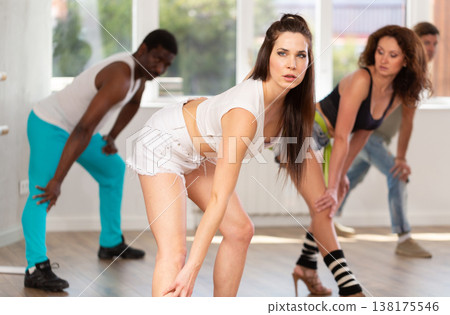 Girl in heels conducts lessons and teaches strip plasticity to visitors of dance 138175546