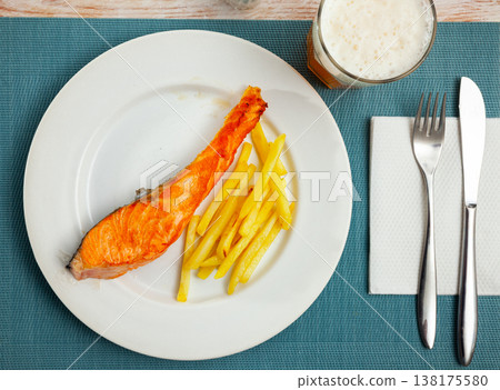 Deliciously steak of baked salmon with french fries Deliciously steak of baked salmon with french fries 138175580