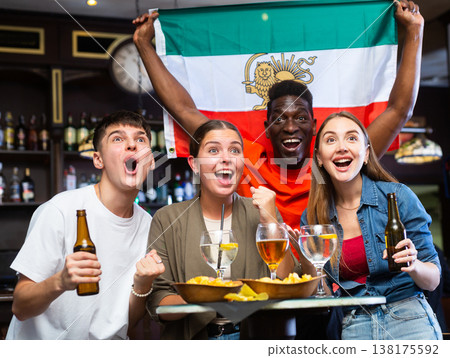 Iran sports fans supporting their favourite team in pub Iran sports fans supporting their favourite team in pub 138175592