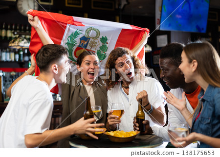 Group of Peru football team fans spending time in bar Group of Peru football team fans spending time in bar 138175653