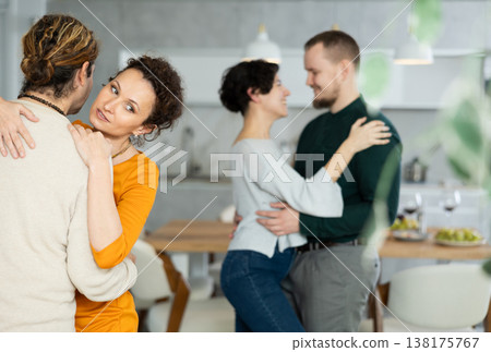 Men and women dancing during house party. Men and women dancing during house party. 138175767