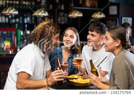 Friendly people spending time in pub Friendly people spending time in pub 138175769