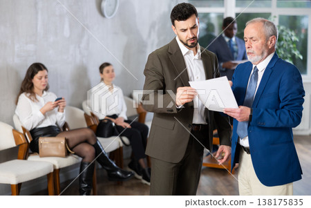 Mature man talking to company manager Mature man talking to company manager 138175835