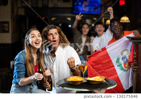 Peru football team fans spending time in bar 138175846