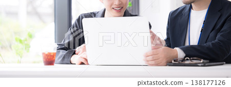 The refreshing image of new employees, such as recent graduates, being encouraged by their superiors during meetings at work; the faceless nature of on-the-job training. The refreshing image of new employees, such as recent graduates, being encouraged by their superiors during meetings at work; the faceless nature of on-the-job training. 138177126